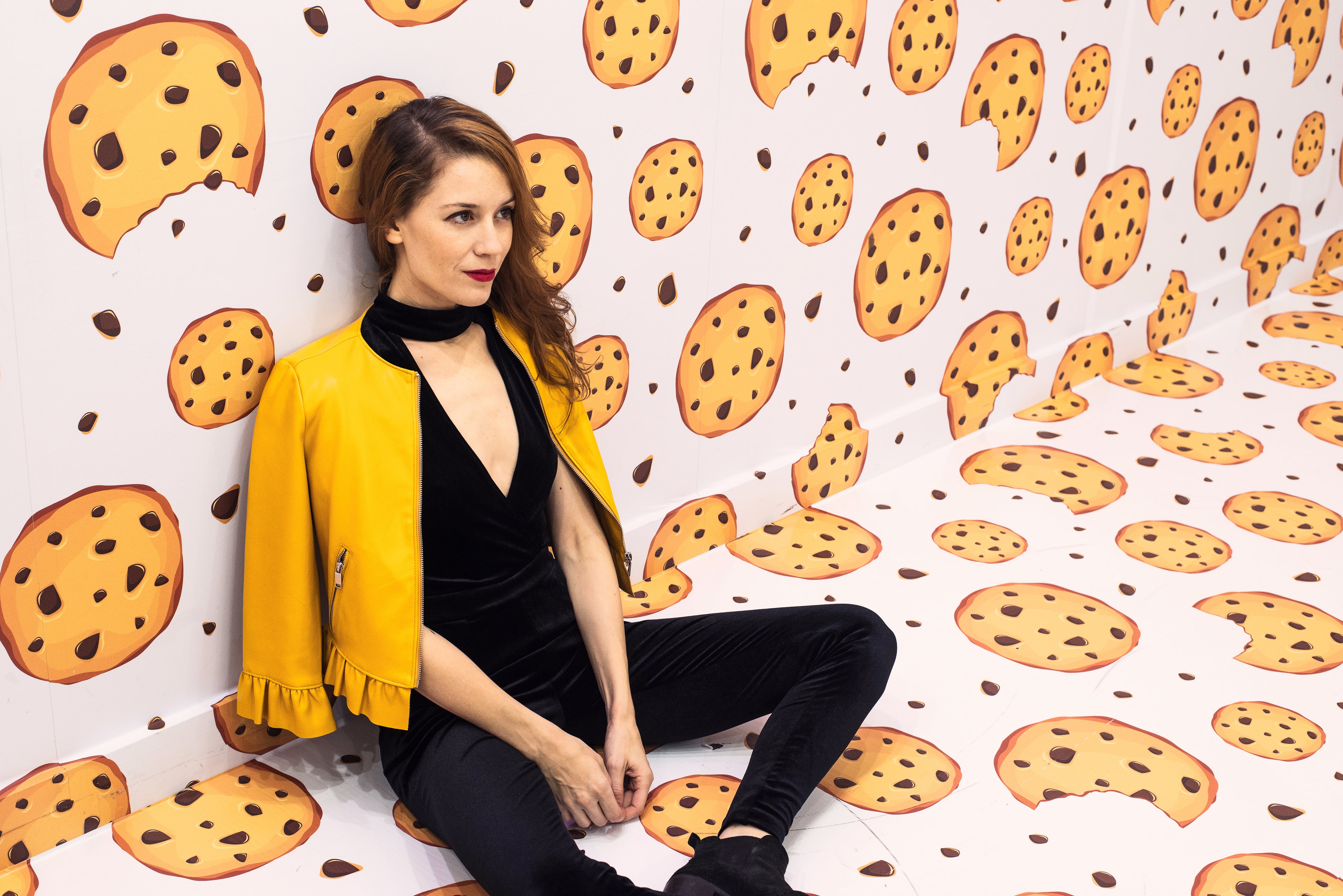 files/woman-leans-against-the-wall-of-a-cookie-themed-room.jpg